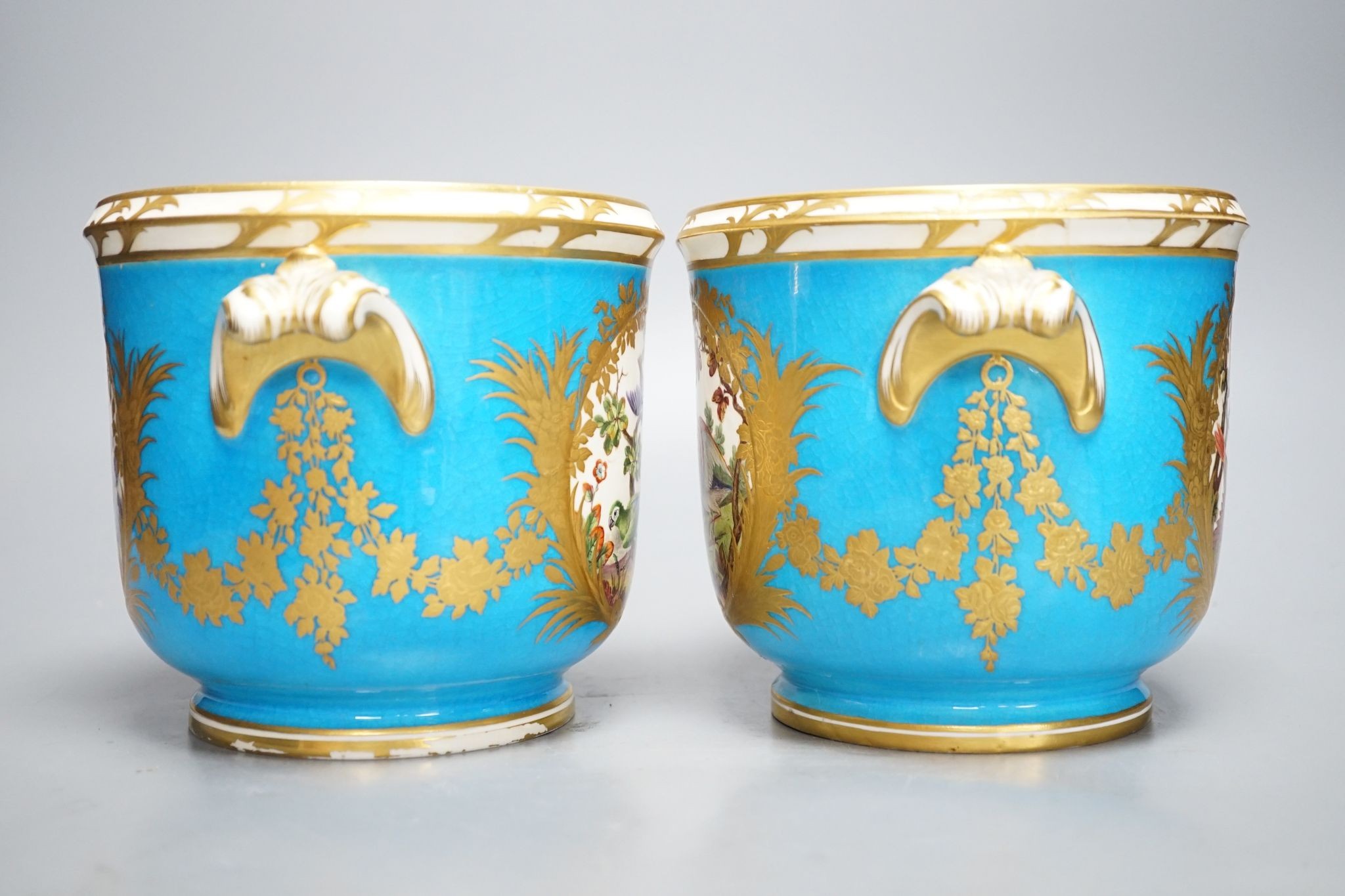 A pair of mid 19th century English porcelain cache pots, 14.5 cms high.
